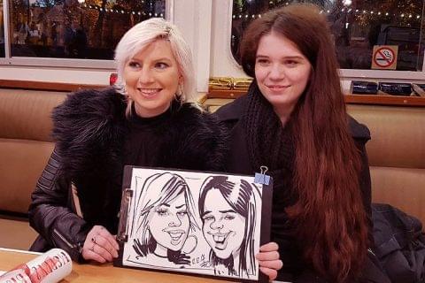 Corporate event caricatures on a boat